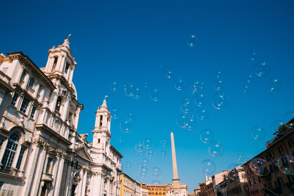 Rome, Italy. Soap Bubbles On Background Of Sant'agnese In Piazza